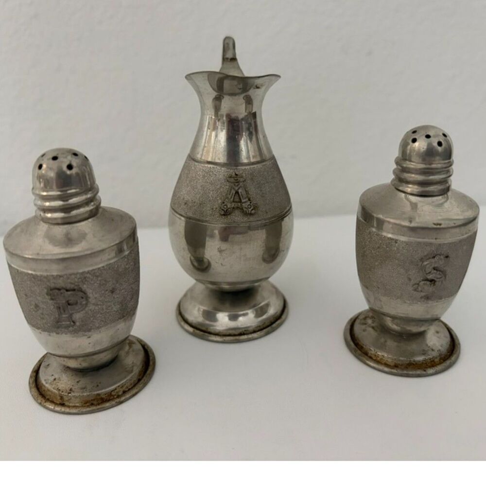 vtg pewter cruet set including salt and pepper shakers and creamer